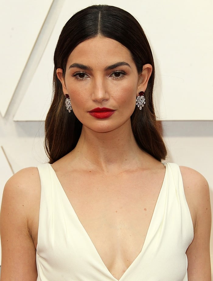 Lily Aldridge looks timeless with red lipstick and center-parted soft curls