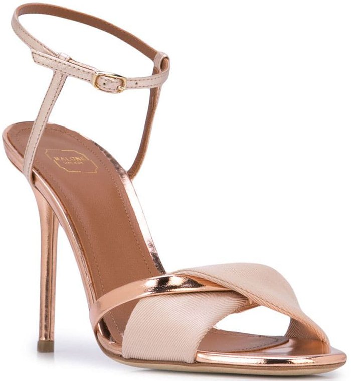 Nude pink and rose gold leather Terry sandals from Malone Souliers by Roy Luwolt featuring an open toe, a high stiletto heel, an ankle strap and a button fastening