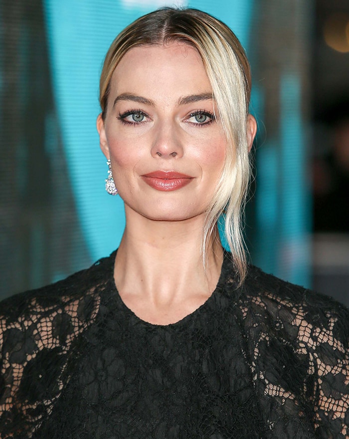 Margot Robbie's kohl-rimmed eyes and swept-back peroxide blonde hair