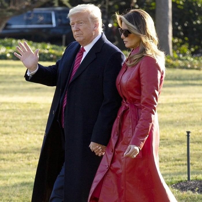 Melania Trump's trench coat is tailored in a timeless silhouette but updated in red faux leather to make it more contemporary