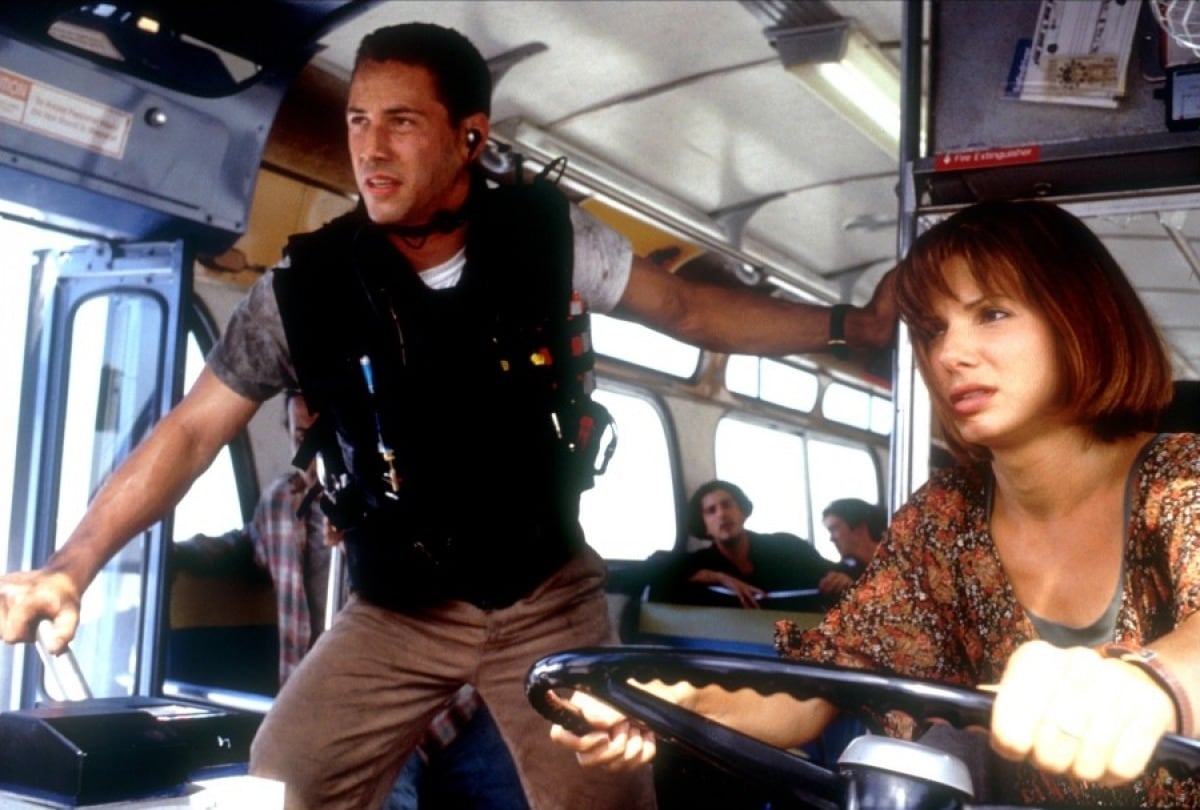 Keanu Reeves as Officer Jack Traven and Sandra Bullock as Annie Porter in the 1994 American action thriller film Speed