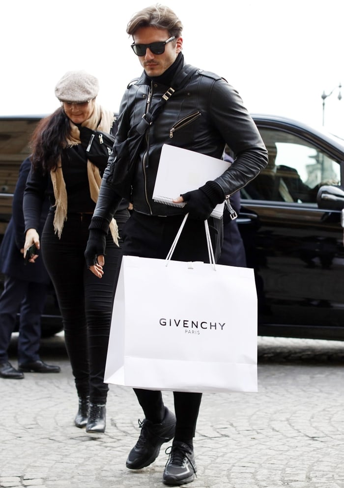 Celine Dion's backup dancer and suspected lover Pepe Muñoz carrying a bag with the official Givenchy logo in Paris