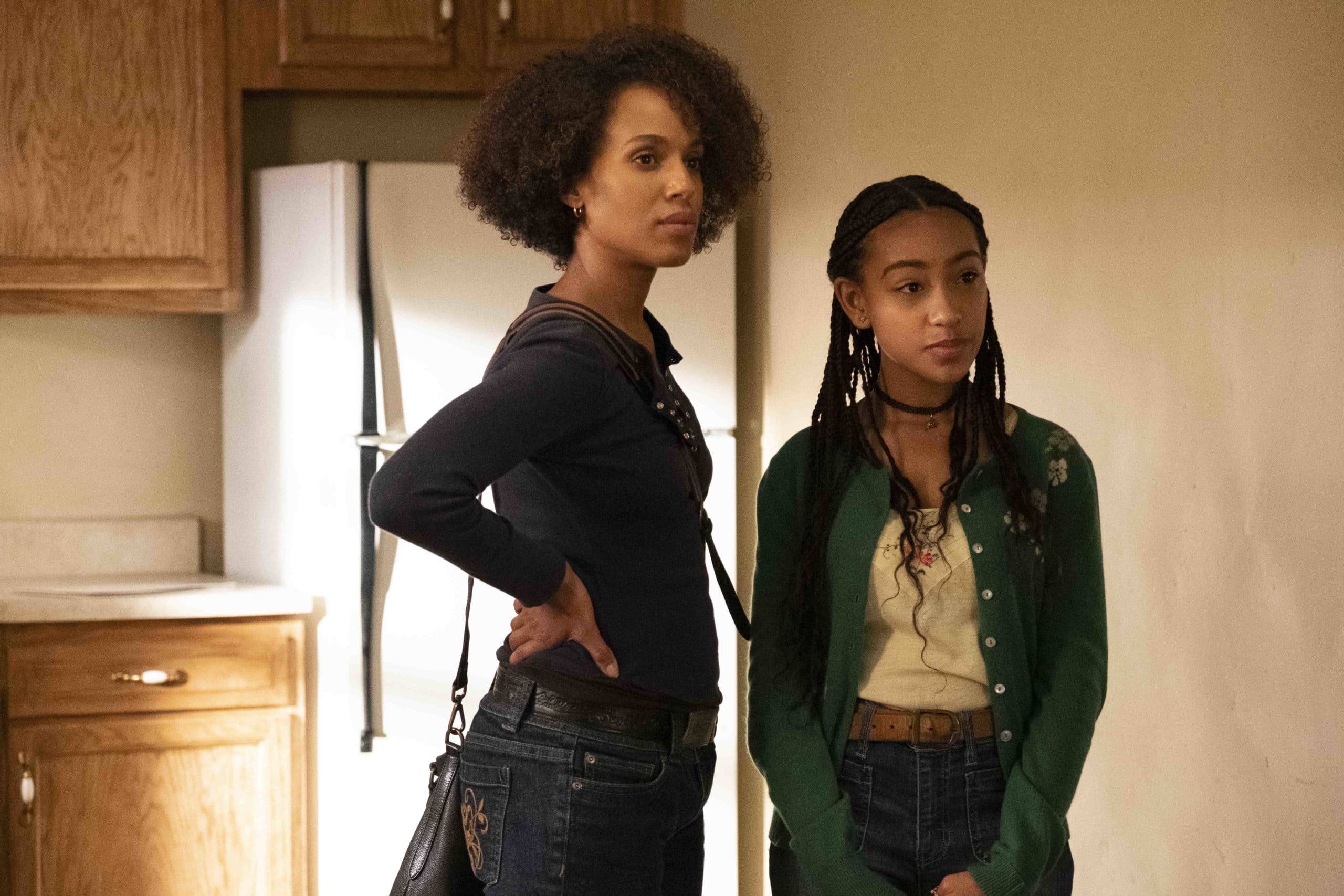 Kerry Washington as Mia Warren and Lexi Underwood as Pearl Warren wear casual, character-driven looks featuring dark-wash jeans and layered tops in a scene from Little Fires Everywhere