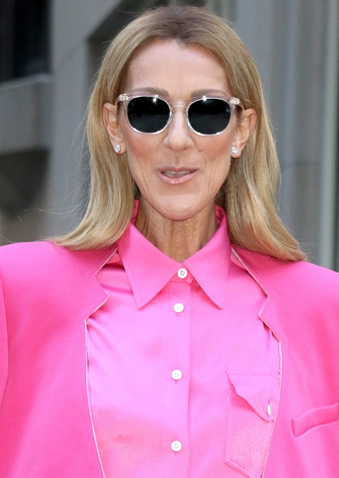 Celine Dion shields her eyes behind black sunnies and wears light pink lip shade