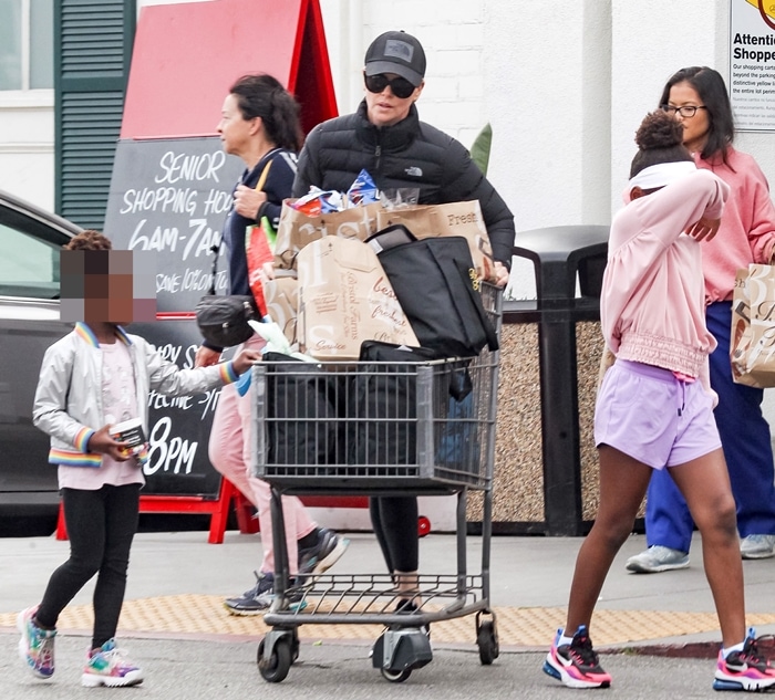 Charlize Theron is seen grocery shopping at Bristol Farms with her black African girls Jackson and August