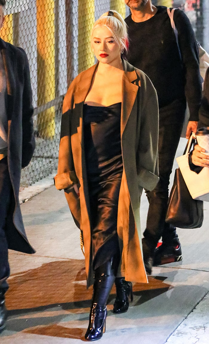 Christina Aguilera leaving Jimmy Kimmel Live studio in silky dress and long coat on March 10, 2020