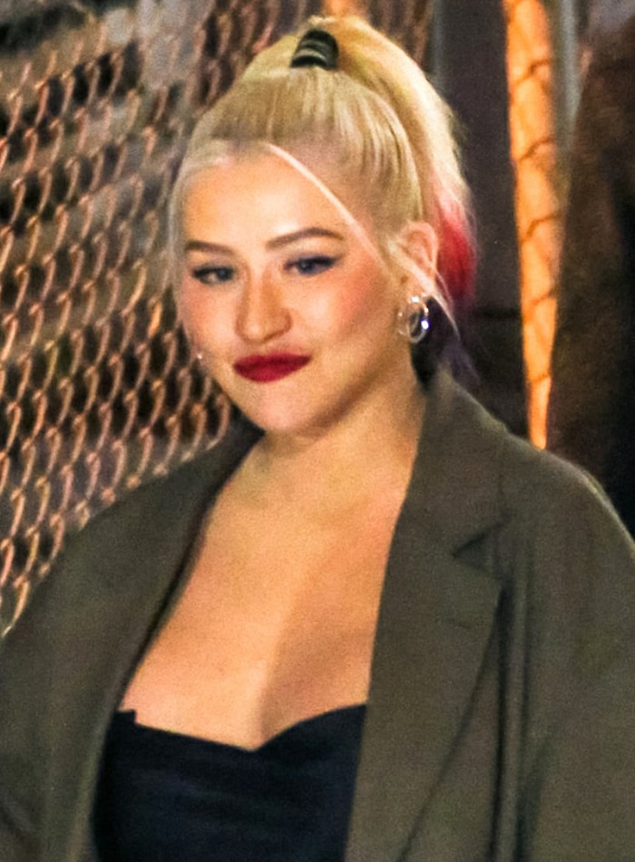 Christina Aguilera wears red lipstick and a high ponytail