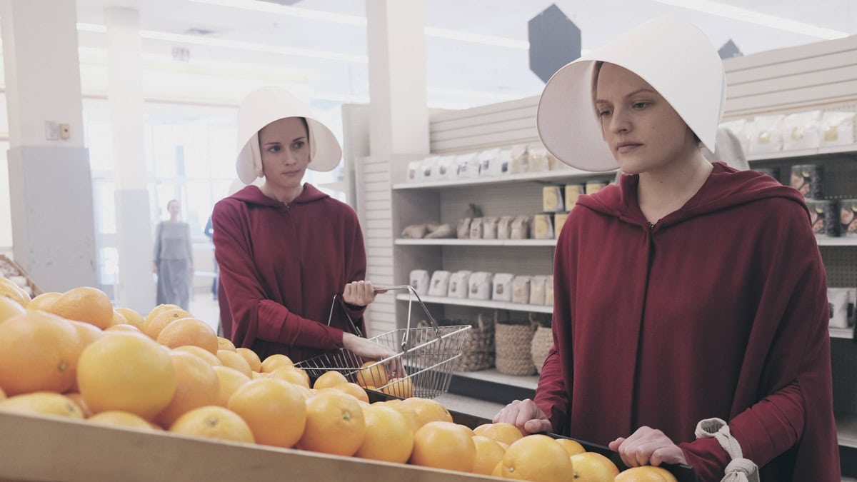 Elisabeth Moss as June Osborne (Offred) and Alexis Bledel as Emily Malek (Ofglen #1) portray the resilience and quiet rebellion of women forced into subservience in the dystopian world of Gilead
