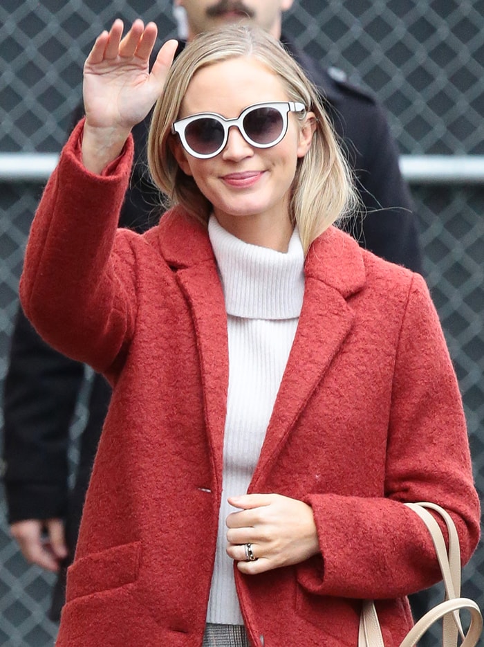 Emily Blunt keeps a low-key look with white-framed sunglasses