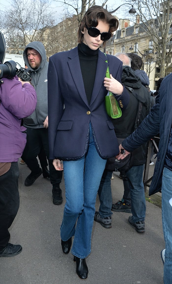 Kaia Gerber in Alexander Wang blazer and jeans after walking Miu Miu's presentation during Paris Fashion Week on March 3, 2020