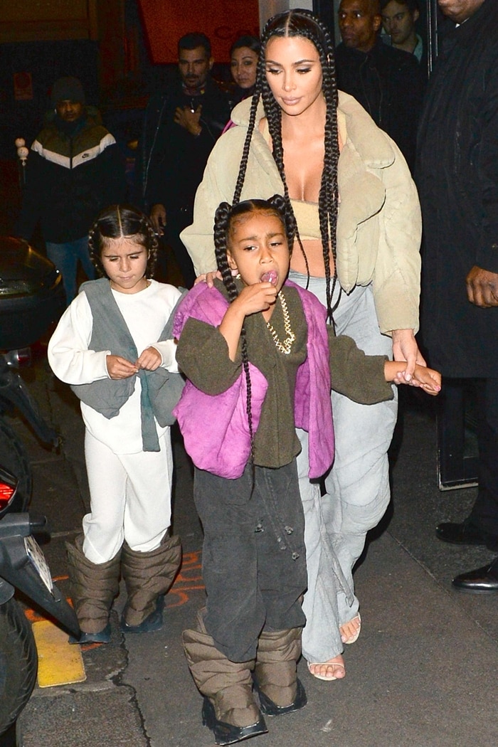 Kim Kardashian West, North West, and Penelope Scotland Disick wearing ridiculous outfit sin Paris