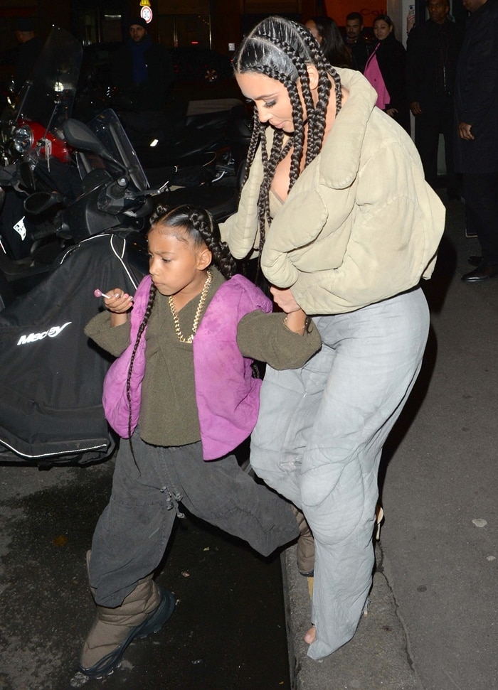 Kim Kardashian West and daughter North West attend the "Yeezy Season 8" show