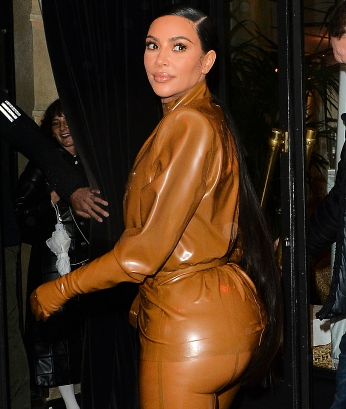 Kim Kardashian shows off her jaw-dropping curves in a latex suit