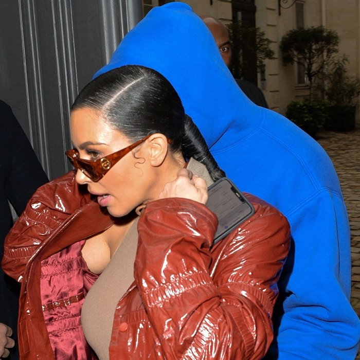Kim Kardashian wears a sleeveless crew neck thong bodysuit