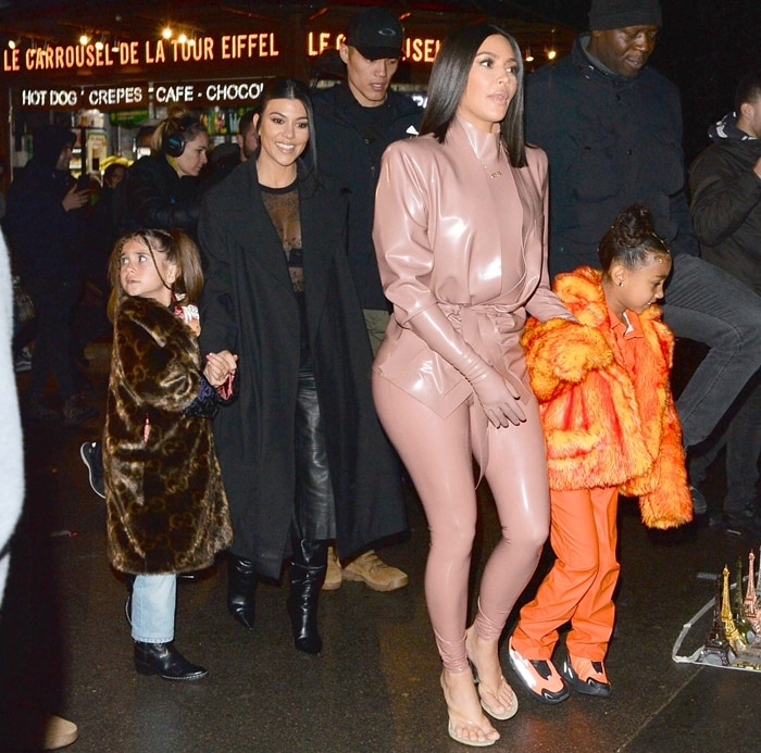 Kim Kardashian, North West, Penelope Disick, and Kourtney Kardashian enjoying an evening in Paris during the city's Fashion Week