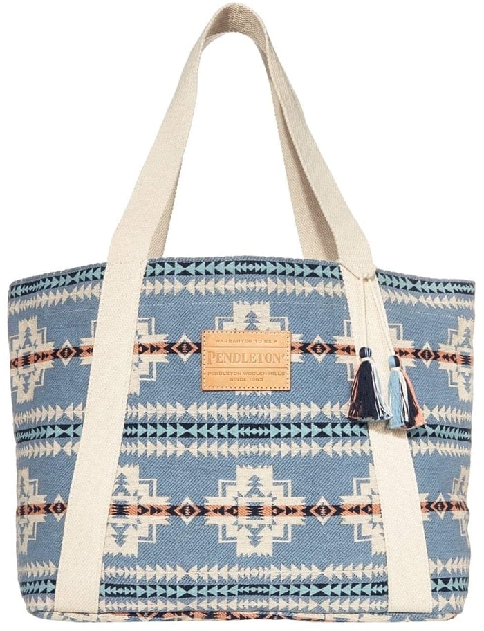 The Pendleton Cotton Tote pairs great with your denim looks with its graphic pattern throughout and tassel detailing