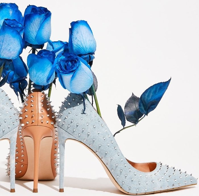 Spiky studs add rocker-chic attitude to a pointed-toe pump lifted by a stiletto heel