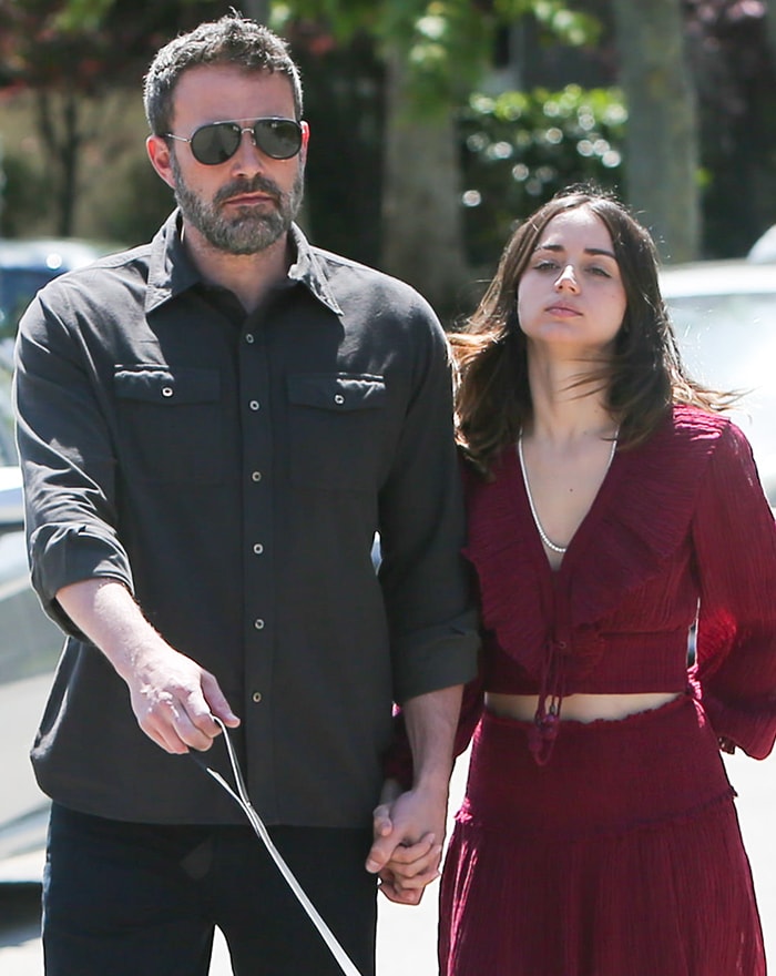 Ben Affleck wears a button-up shirt while Ana de Armas stuns in Zimmermann outfit