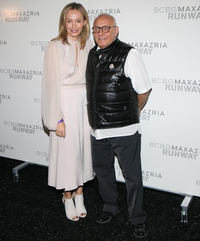 Lubov Azria and her husband Max Azria pose backstage at the BCBGMAXAZRIA fashion show