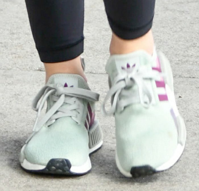 Lucy Hale slips into a pair of Adidas 'NMD' sneakers