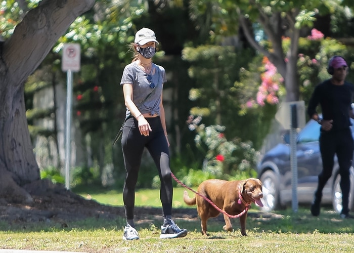 Alessandra Ambrosio wears a mask to jog with her dog in Santa Monica