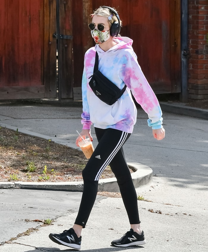 Emma Roberts wearing Adidas soccer pants while going on a coffee run