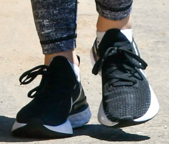 Lucy Hale wears black and white Nike Renew Run sneakers