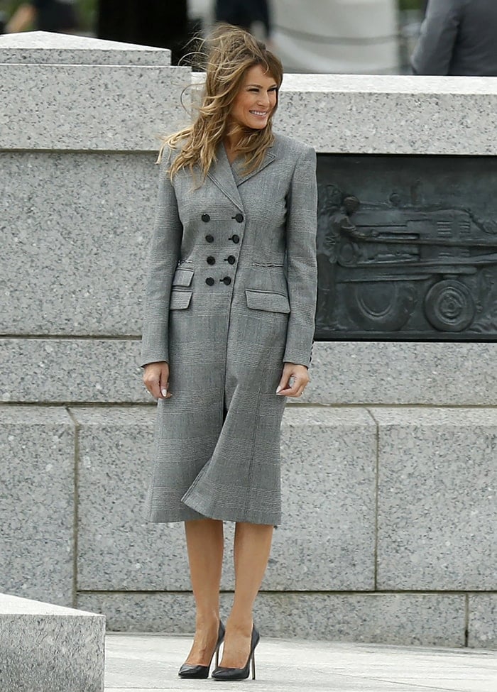 Melania Trump in a gray Altuzarra plaid coat dress and Manolo Blahnik pumps