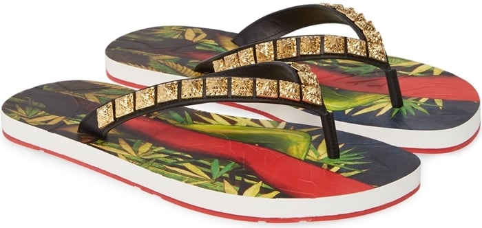 Textured pyramid studs shine along the straps of a flip-flop finished with a bold signature detailing the Louboutin-red sole