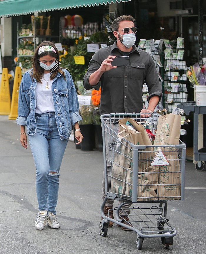 Ana de Armas wears double denim trend with a headscarf, Foundrae jewelry, and Cartier bangle and watch