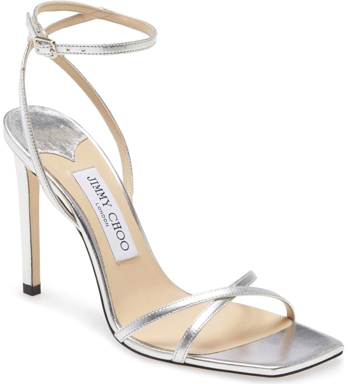 Ready for the red carpet, this minimalist ankle-strap sandal becomes a major showstopper with a squared-off toe and metallic leather