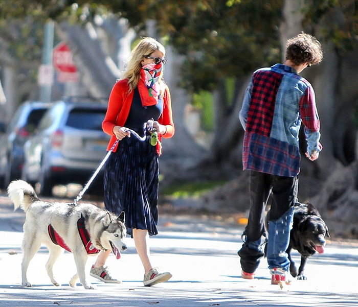 Laura Dern opts for a chic dress, while her son wears a patchwork plaid shirt
