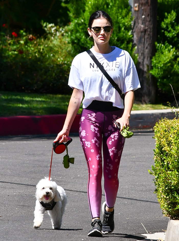 Lucy Hale walks her dog, Elvis, around her neighborhood in Los Angeles on June 7, 2020