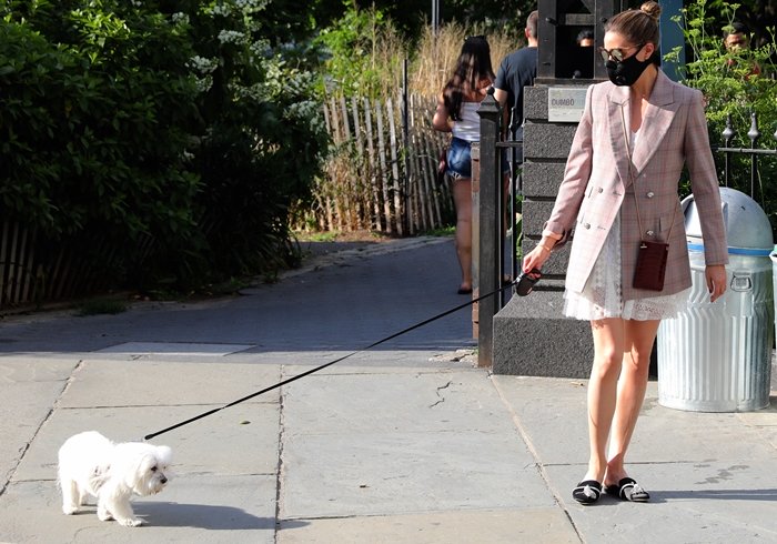 Olivia Palermo flaunts her legs in black satin Louis 20mm mules from Giannico