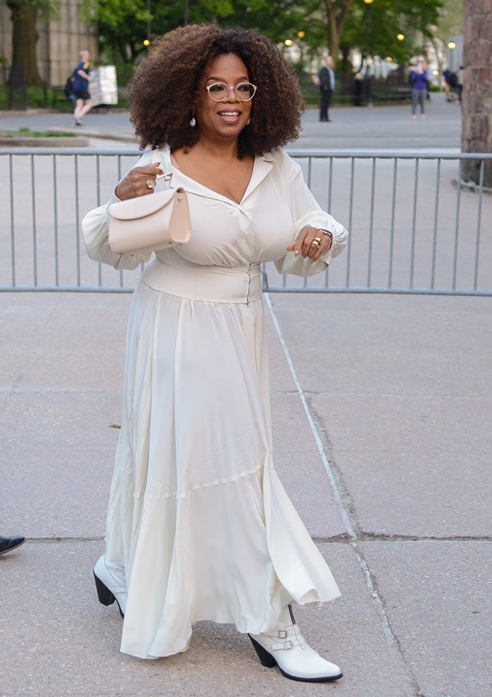 Oprah Winfrey accentuates her 5'7" frame with heeled booties at the Statue Of Liberty Museum opening celebration