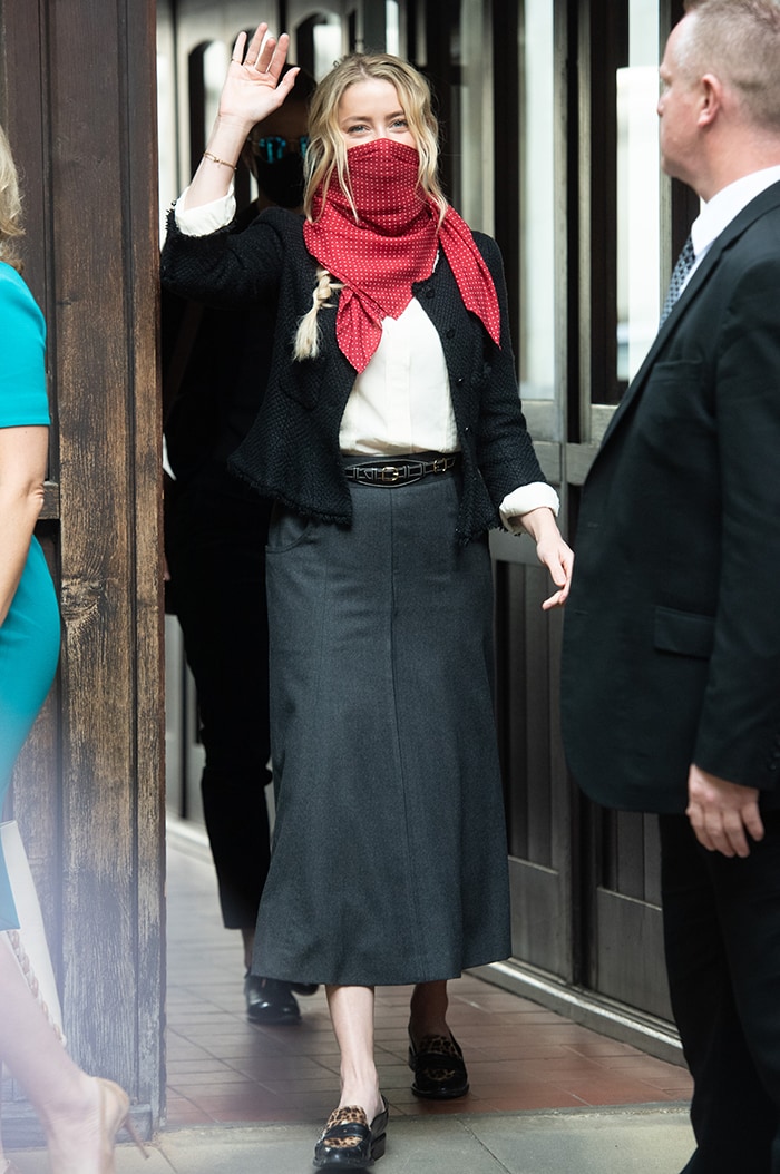 Amber Heard teams her red scarf with a white shirt, black blazer, and gray maxi skirt on July 17, 2020