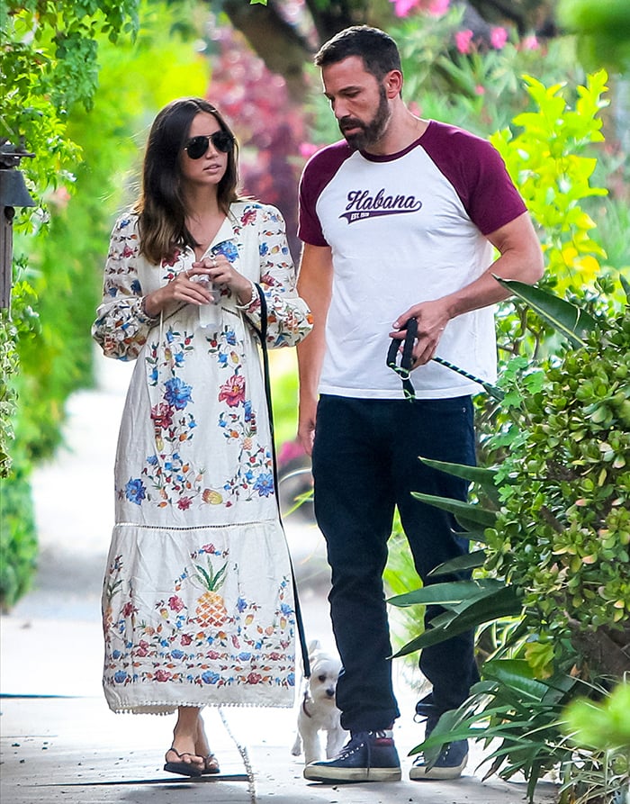 Ana de Armas embraced boho-chic style in a floral embroidered maxi dress paired with classic black Havaianas flip-flops