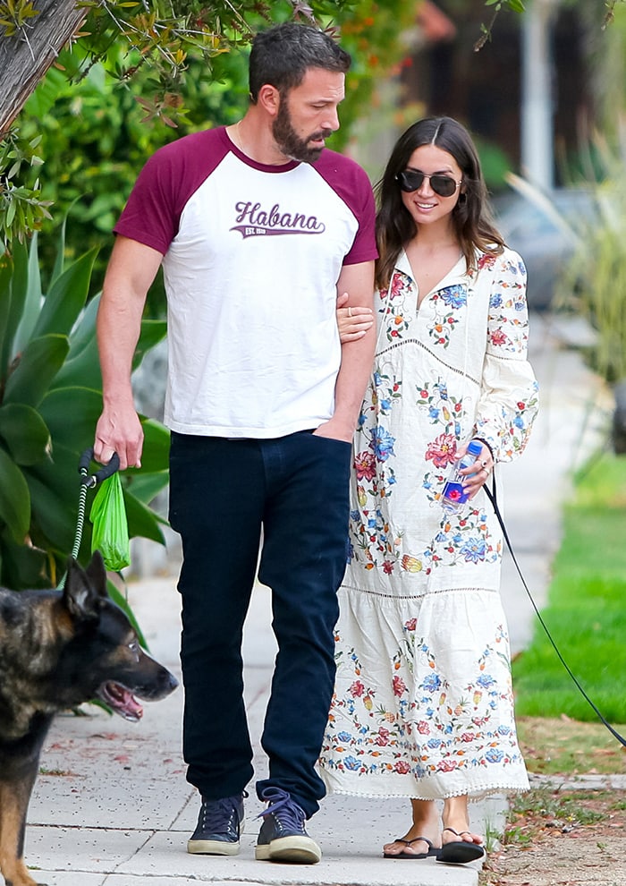 Ana de Armas wraps her arm around Ben's biceps