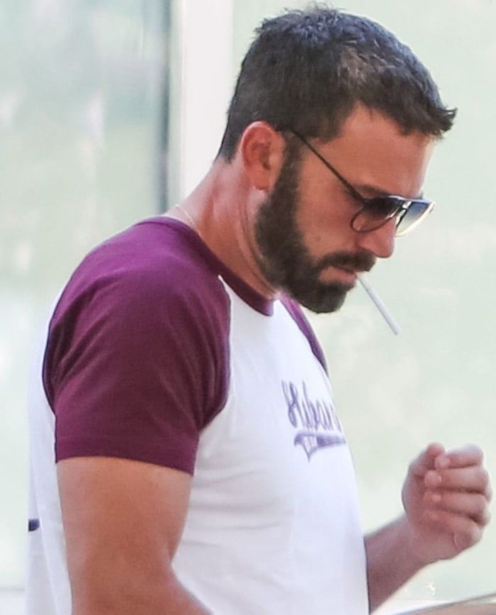 Ben Affleck apparently trying to light a cigarette with an empty hand