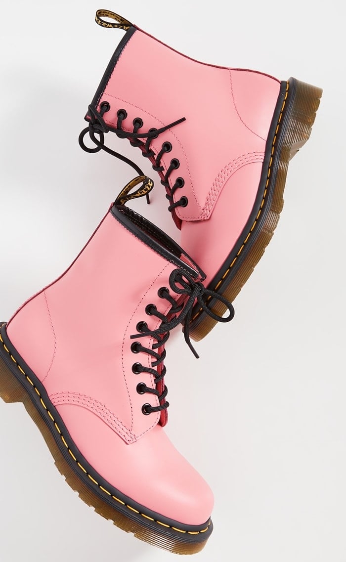 Vibrant twist on a classic: Dr. Martens' 1460 iconic boots in eye-catching acid pink leather