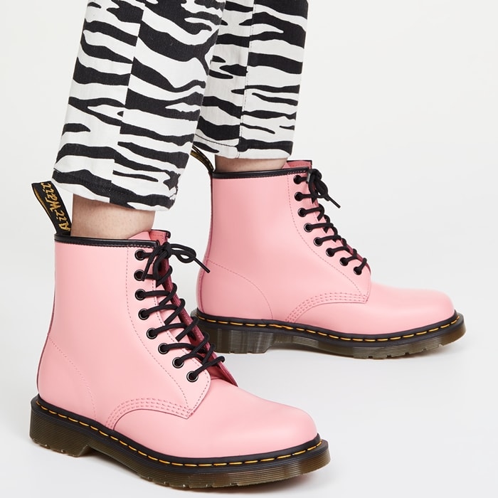 Fashion forward: pairing pink Dr. Martens with striking zebra-print skinny jeans for a standout ensemble