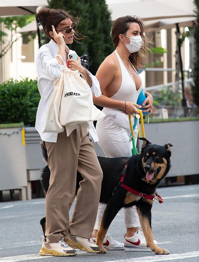 Emily Ratajkowski walks her dog, Colombo, with a friend in New York City on July 28, 2020