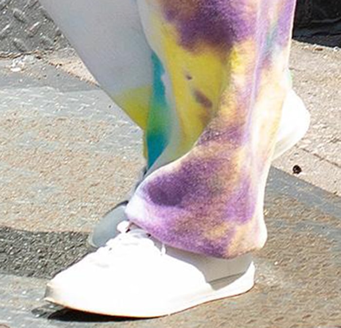 Emily Ratajkowski pairs her tie-dye sweatpants with classic white Veja Esplar sneakers for a laid-back yet trendy look