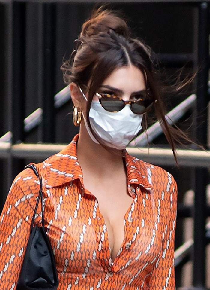 Emily Ratajkowski wears a face mask and Versace sunglasses