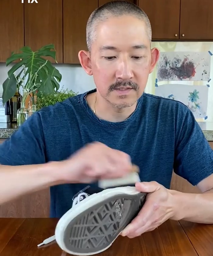 Jason Markk uses a soft-bristle brush to remove dust and surface dirt