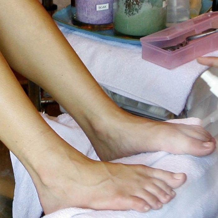 Kristin Cavallari's well-maintained feet, shown during a pedicure session, highlight her attention to detail in her beauty regimen