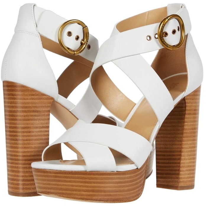Wide crisscross straps and a retro-inspired platform heel elevate dressy looks with a vintage feel in the Leia sandals from Michael Michael Kors