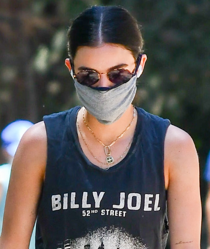 Lucy Hale keeps it low key with Reality sunglasses and a cloth face mask