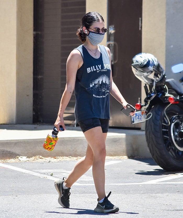 Lucy Hale wears Daydreamer Billy Joel tank top and biker shorts