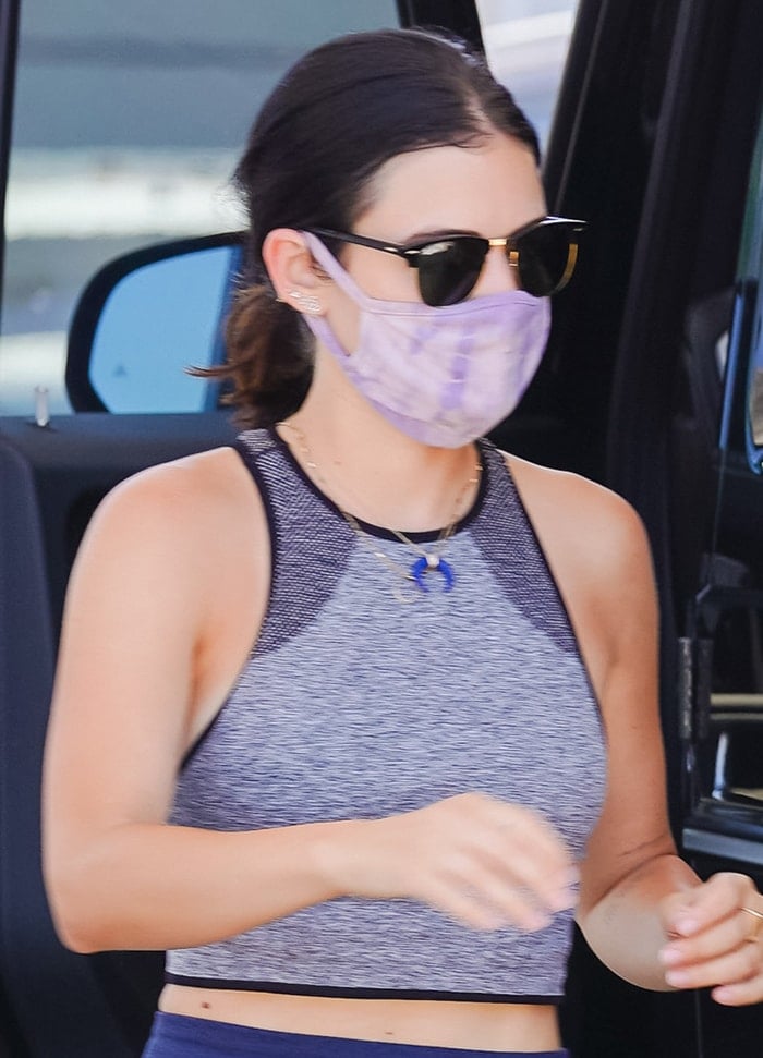 Lucy Hale wears lavender Nikxie face mask and Ray-Ban sunglasses